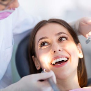cosmetic dentistry woman smiles at surgery