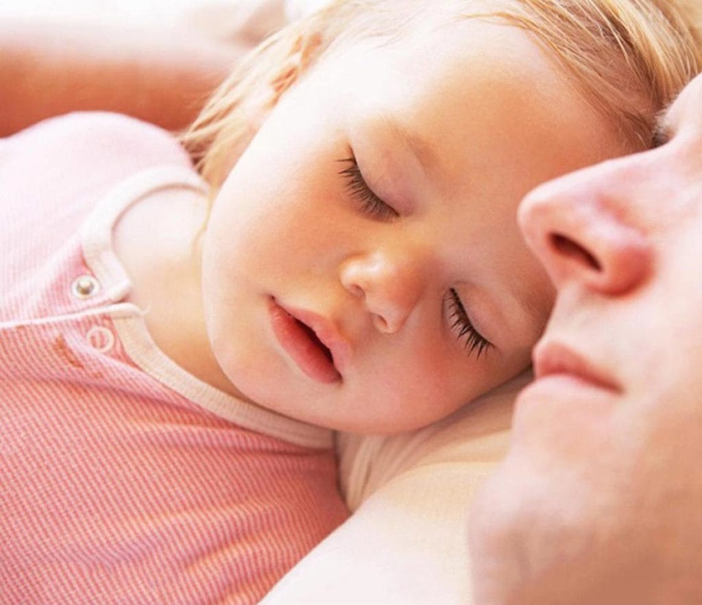 dad and child sleep calmly