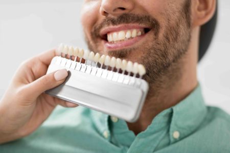 patient picking the colour of porcelain veneers