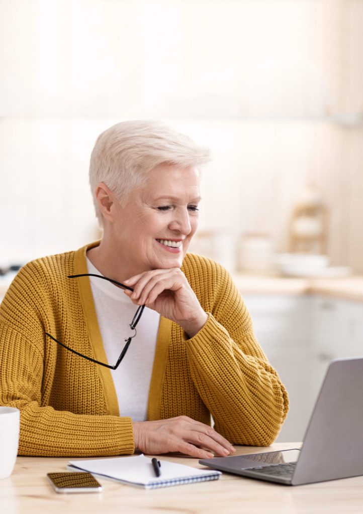 woman-thinking-about-dental-implant-all-on-4-in-the-kitchen