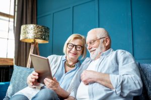 elder couple thinking about All-teeth-on-4 dental implants
